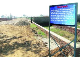 A signboard warns buyers of an unauthorised colony in Ludhiana