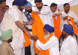Deputy Chief Minister Sukhbir Singh Badal welcoming Congress activists who joined the ruling Shiromani Akali Dal at village Chak Attar Singh Wala in Bathinda on Saturday.