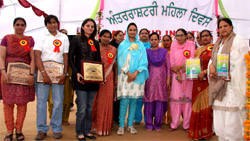 Harsimrat Kaur Badal poses for a group photo after honouring women players and artists during Womens Day celebrations at the Baba Farid Institute on Saturday.