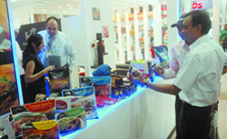 Visitors check out a stall during the ongoing Aahar food festival at Pragati Maidan in New Delhi 