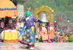 A Buddhist monk performing a mask dance at a function on the concluding day of the Chheeshu Fair at Rewalsar in Mandi district on Saturday.