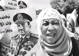 A woman during a protest against the International Criminal Courts warrant against Sudans President Omar Hassan al-Bashir. The court found him guilty of genocide over a conflict, that UN officials say, has killed as many as 3,00,000 persons since 2003.