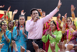 Sarabjeet Cheema, folk singer-turned-actor, performing along with the winners of a cultural dance contest organised by a private channel at DAV College in Bathinda on Sunday.
