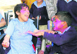 Special kids celebrate Holi at Raphael Home in Dehradun on Monday. 