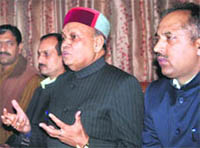 Prem Kumar Dhumal talking to mediapersons at a press conference at Shimla on Monday.