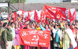 Anganwari workers hold a rally in support of their demands at Dharamsala on Monday.