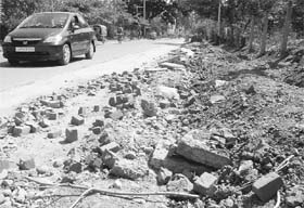The abandoned work at the approaching road to Ram Darbar from Industrial Area, Phase II, till the Community Centre