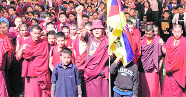 Tibetans hold a protest on the 50th anniversary of the Tibetan Uprising at Gandhi Park in Dehradun on Tuesday.