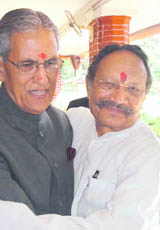 The Chief Minister greets Governor BL Joshi on the eve of Holi at Dehradun in Raj Bhawan on Tuesday.