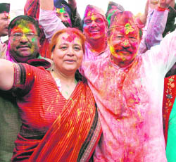CM BC Khanduri dance with party workers at a holi milan programme