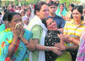 Wailing family members of Aman Kachru at their home in Gurgaon