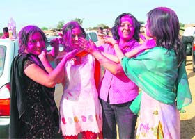 Students of Guru Gobind Singh Dental College, Budhera, near Gurgaon, celebrate Holi