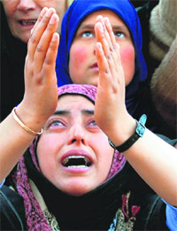 Muslim women pray at Hazratbal shrine in Srinagar on the occasion of Id-e-Milad-un-Nabi on Monday.