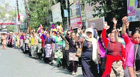 Tibetan women hold a protest march to commemorate the 50 years of their struggle in Dehradun