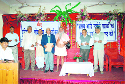 Swami Sharnanand releases Prof Anirudh Yadavs booklet at a convention in Rewari.