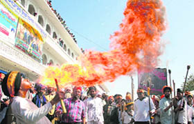 A Sikh teenager breathes out fire during Hola Mohalla at Anandpur Sahib on Wednesday
