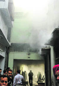 Smoke billows out of a godown of plastic goods after a fire broke out there due to a shor-circuit in Amritsar on Thursday.