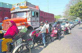 Traffic jam at Tribune Chowk due to road recarpeting in Chandigarh on Friday.
