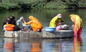 DHOBI GHAAT: In this scientific era, women wash clothes with hands near Gurgaon.