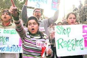SFI activists hold a candlelight march against the death of Aman Satya Kachroo, protesting against ragging in institutions, in Shimla