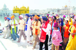 Assamese Sikhs visit Punjab for the first time to pay obeisance at the Golden Temple in Amritsar on Friday.