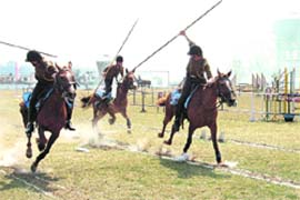 Cadets of Rashtriya Indian Military College (RIMC) participate in a tent-pegging competition during its Foundation Day celebrations in Dehradun