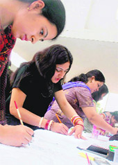 Students participate in a painting competition at the JD Institute of Fashion Designing on Saturday.
