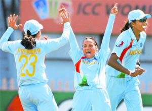 Indias Amita Sharma (c) celebrates with teammates Priyawka Roy (L) Jhulan Goswami  after taking a wicket during the Womens World Cup match against Australia at North Sydney Oval in Sydney on Saturday.