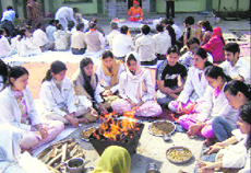 Students and staff of Dr RP Goverment Medical College, Tanda, take part in a havan in memory of Aman Kachroo on Sunday.