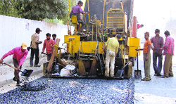 Work on the construction of a road from Shashtri Chowk to Alaska Chowk in full swing in Jalandhar on Sunday.