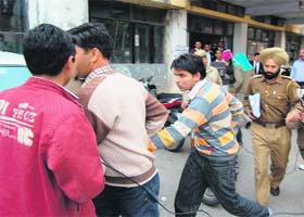 Accused students in the Aman Kachroo ragging case being produced by policemen in judicial courts at Dharamsala
