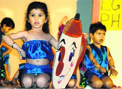 Kids perform a dance during the annual function of Swiss International School in Ludhiana on Monday