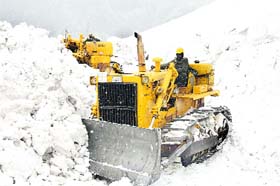 Snow-clearing in full swing near Rani nullah, about 42 km from Manali, on the Manali-Rohtang Pass road