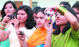 Students clicking photographs of their friends during their farewell party at St. Soilder College, Basti Danishmandan in Jalandhar. 
