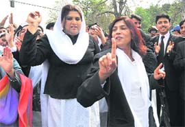 Pakistani lawyers celebrate the restoration of Supreme Court Chief Justice Iftikhar Muhammad Chaudhry in Lahore on Tuesday
