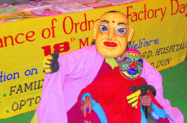 Students wearing masks at a function to mark Ordnance Day in Dehradun on Wednesday.