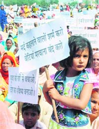 A girl leads a protest rally against female foeticide and drugs organised by the Youth Welfare Federation in Karnal