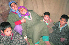 Inconsolable family members of carpenter Ghulam Mohiuddin Malik, who was killed allegedly in CRPF firing in Pulwama district on Wednesday.