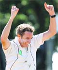 New Zealand's Iain O'Brien celebrates dismissing Rahul Dravid on day two of their first test cricket match in Hamilton. 