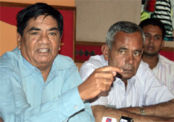 Joginder Dyal, national executive member of the CPI, and Hardev Arshi, party candidate for the Bathinda seat, speaking to media in Bathinda on Friday.