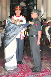 The President awards Shaurya Chakra to Major Sunder Bisht in New Delhi on Thursday. 
