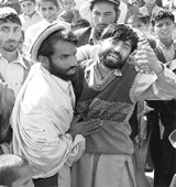 The brother of an Afghan man who was killed in what the US military called an overnight raid weeps in Bati Kot district in Nangarhar province, 140 km east of Kabul, on Friday.