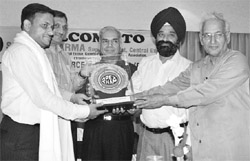 A.K. Sharma, superintendent, Central Excise and Customs, being honoured by the Apex Chamber of Commerce and Industry in Ludhiana on Saturday.