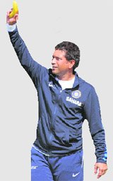 Sachin Tendulkar waves a banana to Harbhajan Singh as a joke reffering to his bowling on Saturday.