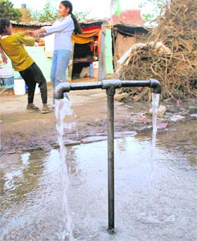 WATER WATER EVERYWHERE AND A LOT OF IT TO WASTE: Precious drinking water flows down the drain on World Water Day at the Sector 25 colony in Chandigarh
