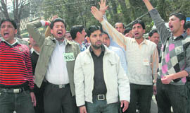 Activists of NSUI raise anti-ragging slogans in front of Indira Gandhi Medical College in Shimla on Monday where two students were suspended for ragging.