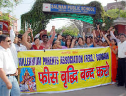 Parents protest against fee hike by private schools outside Salwan Public School at Sector-15 in Gurgaon on Tuesday.