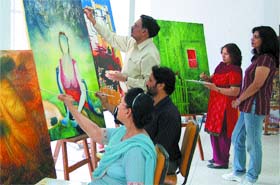Artists during a painting workshop at Virsa Vihar in Jalandhar. Photo: Suryakant