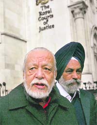 Campaigner Davender Ghai (left), founder of the Newcastle-based Anglo-Asian Friendship Society, arrives at The Royal Courts of Justice in London to challenge the law on religious burials in the Britain
