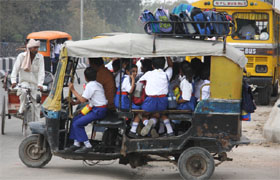 An overloaded auto-rickshaw carrying school students in Bathinda on Wednesday.